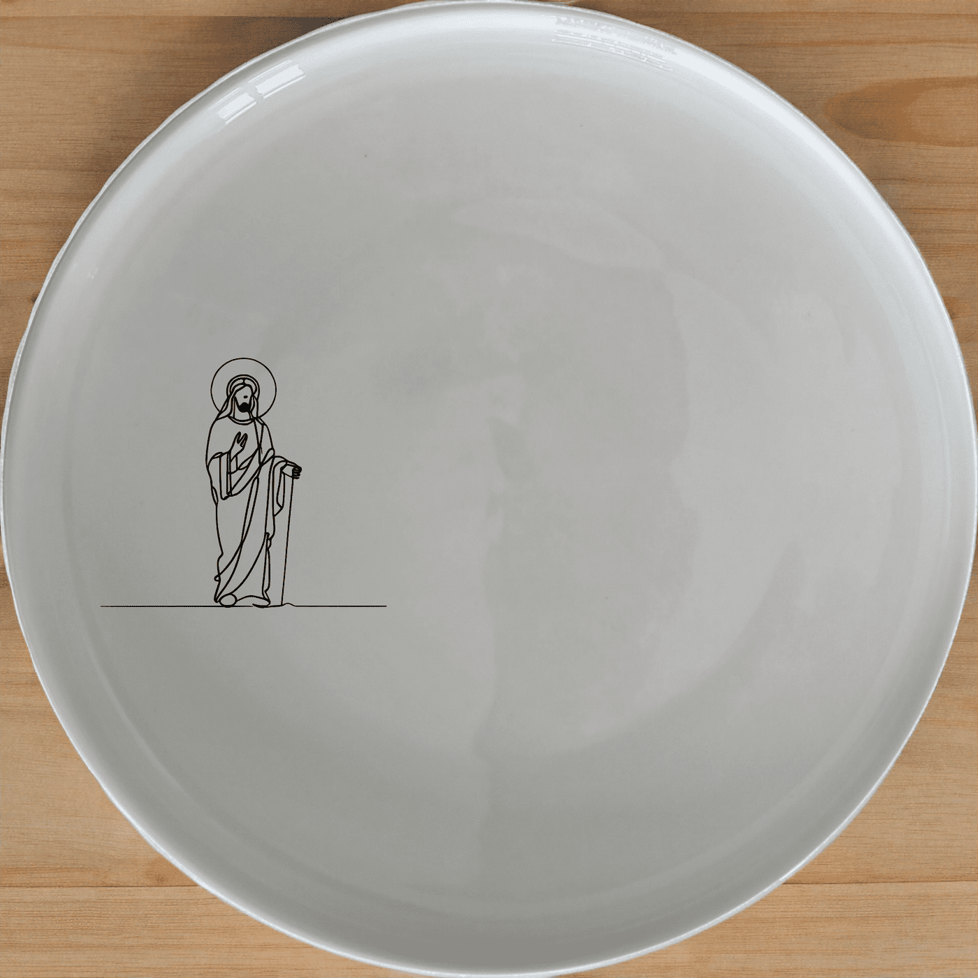 Jesus Statue Side Plate Set of 4 is a beautifully designed set of four white ceramic side plates featuring an elegant laser-etched Jesus statue design. Perfect for everyday use or special occasions.