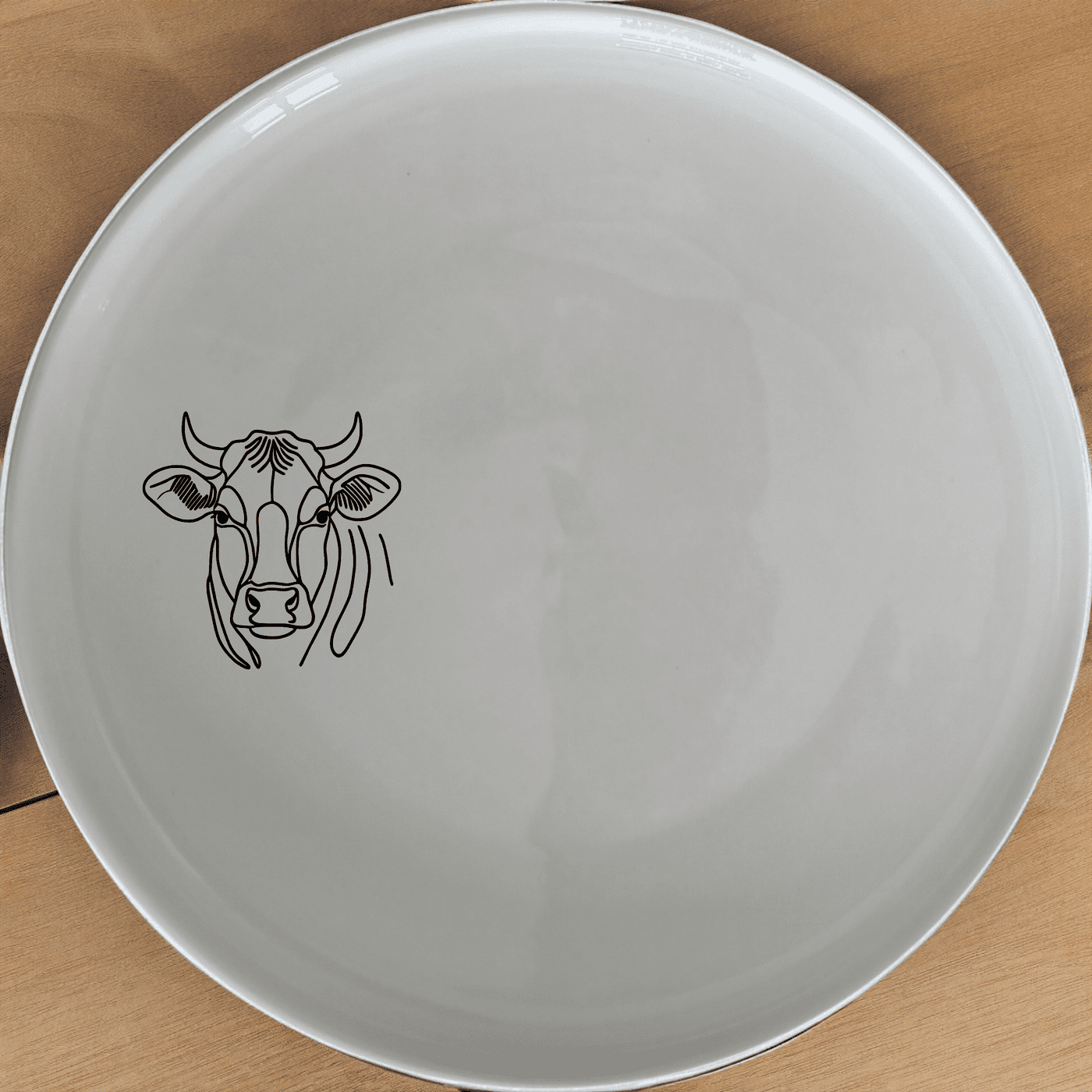 The Curvey Fat Jersey Cows Side Plate Set of 4 - Range 2 adds a charming touch to your dining table with its unique design and high-quality ceramic construction.