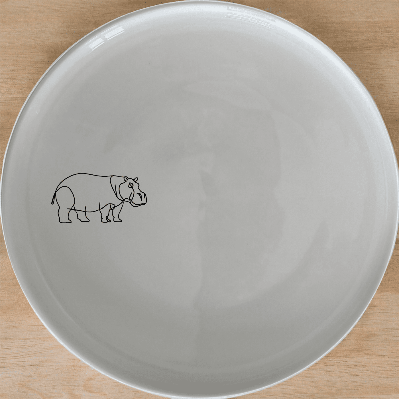 The Curvey Sillohuette Hippo Dinner Plate Set of 4 - Range 2 features a sleek, modern design with a subtle silhouette of a hippo, perfect for contemporary dining settings.