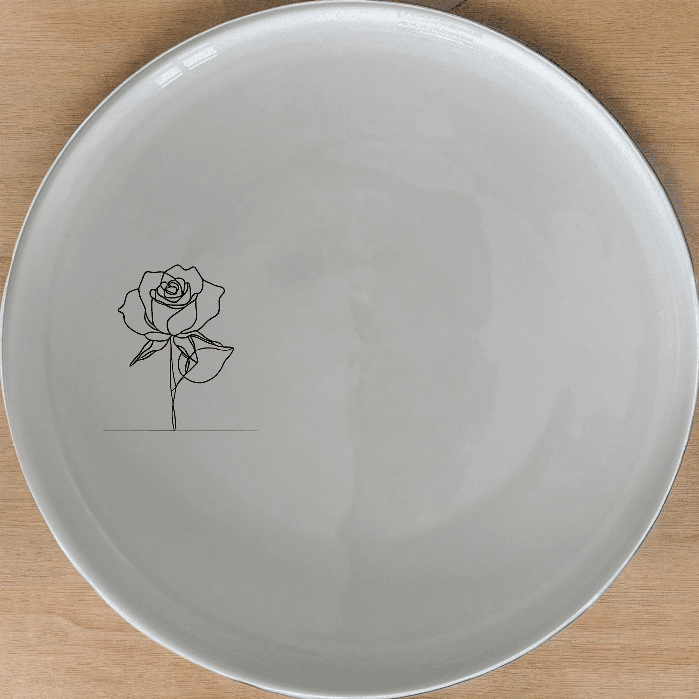 The Delicate Roses Dinner Plate Set of 4 features a minimalist rose design, perfect for adding a touch of elegance to any dining occasion.