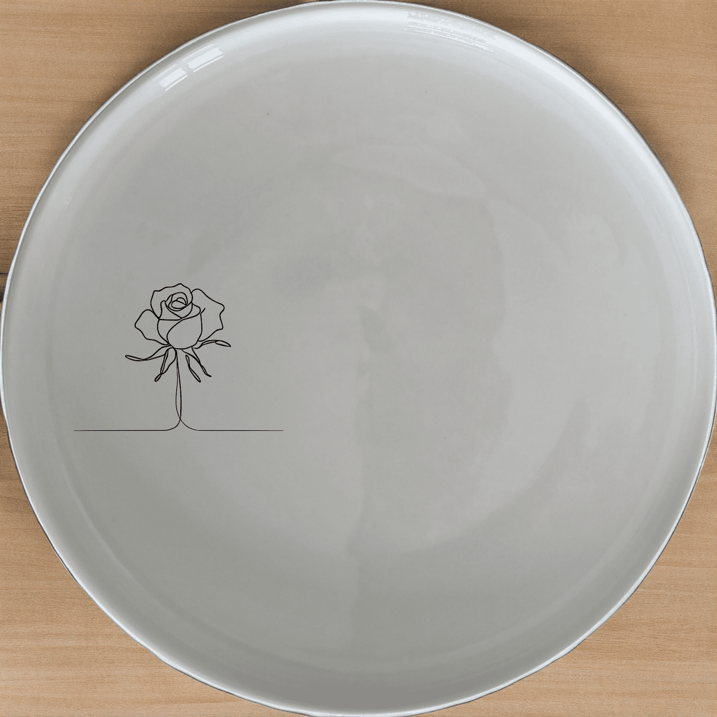Delicate Roses Side Plate Set of 4 offers a minimalist design perfect for any dining setting. This set of four plates features a subtle rose etching that adds a touch of elegance to your table.