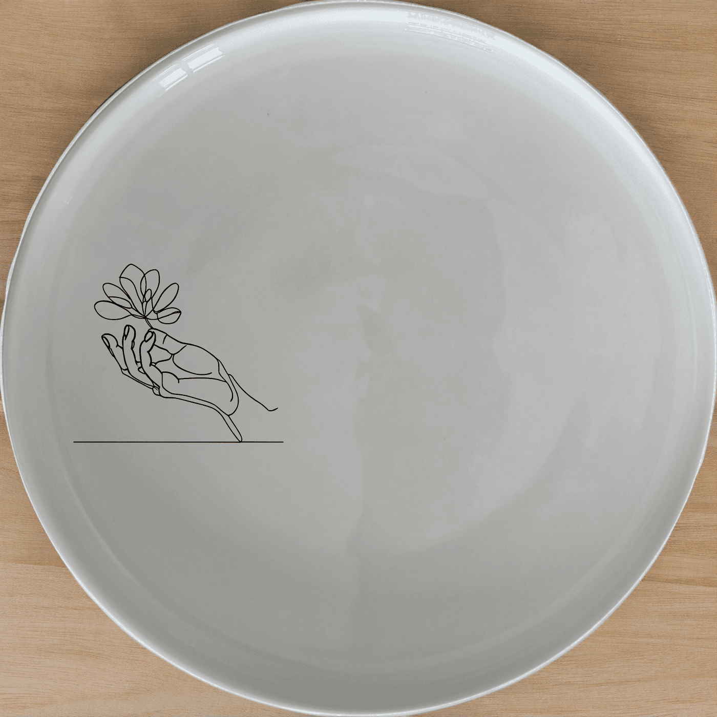 The Drawing Hand Dinner Plate Set of 4 - Range 2 features a minimalist design perfect for modern dining. Crafted from premium ceramic, these plates are both stylish and durable.