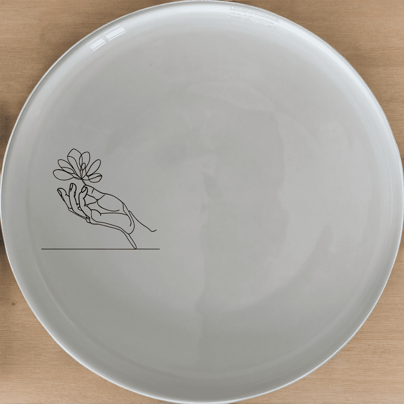 The Hand Drawing Side Plate Set of 4 - Range 2 features a minimalist, abstract design perfect for modern dining. Crafted from durable ceramic, these plates are dishwasher and microwave safe, making them ideal for everyday use.