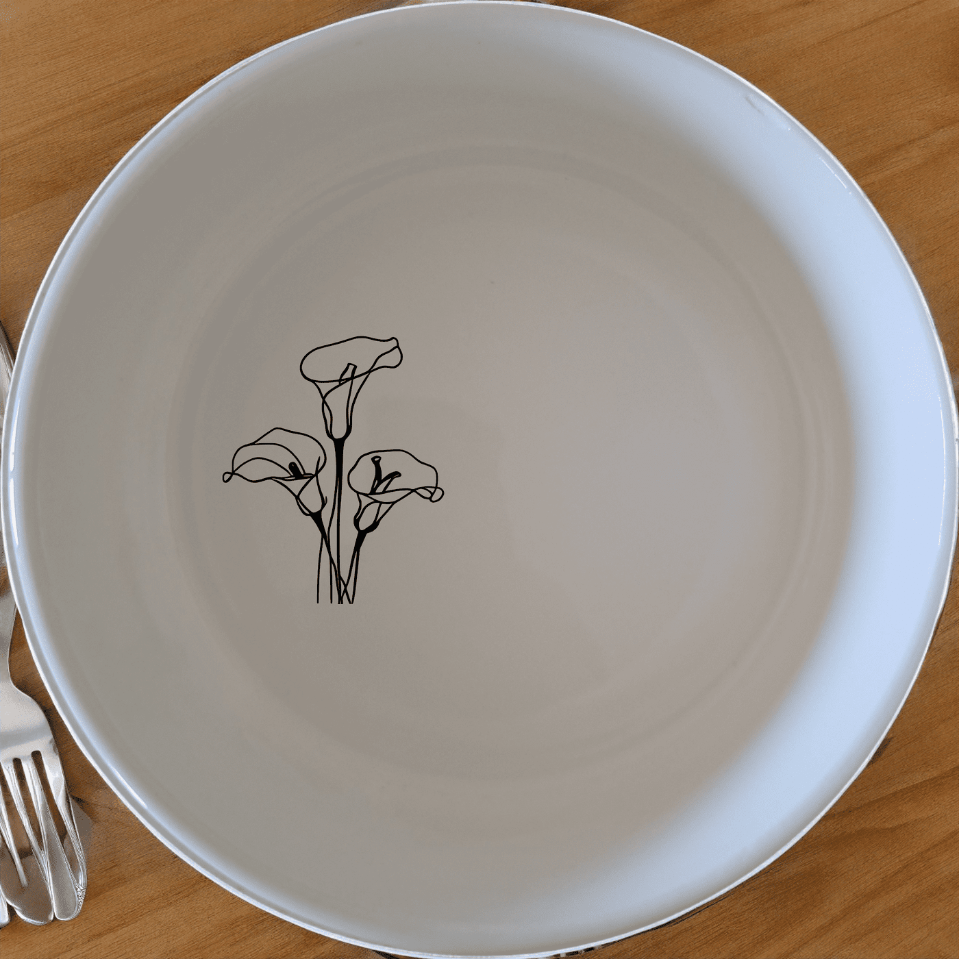 Arum Lilies Bowl Set of 4 - Range 1 is a beautiful, minimalist set of four white ceramic bowls, each featuring a delicate laser-etched design of arum lilies. Perfect for everyday use or special occasions, these bowls add a touch of elegance to any dining table.