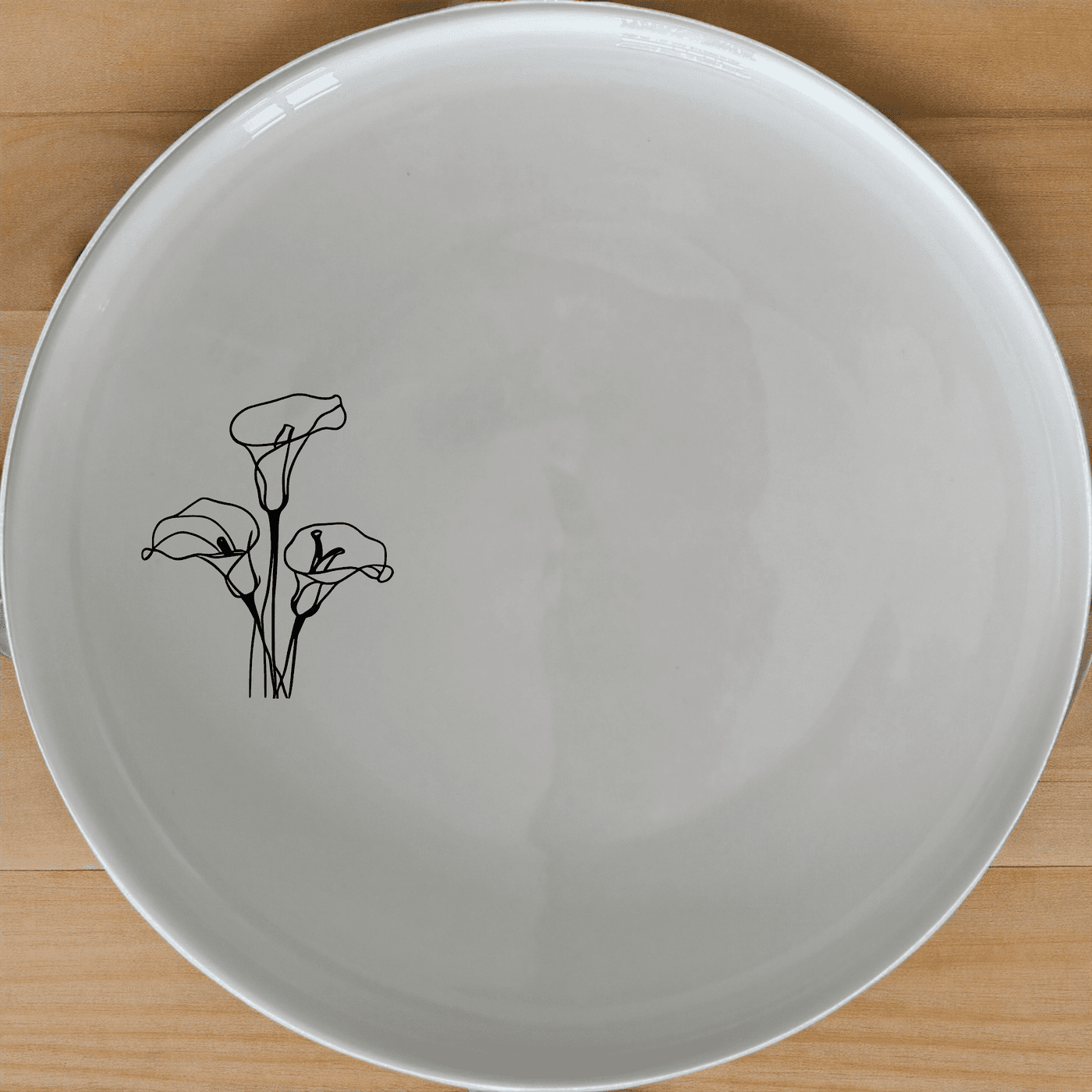 Arum Lilies Dinner Plate Set of 4 - Range 1 is a stunning addition to any dining table, featuring elegant laser-etched designs on white ceramic plates.