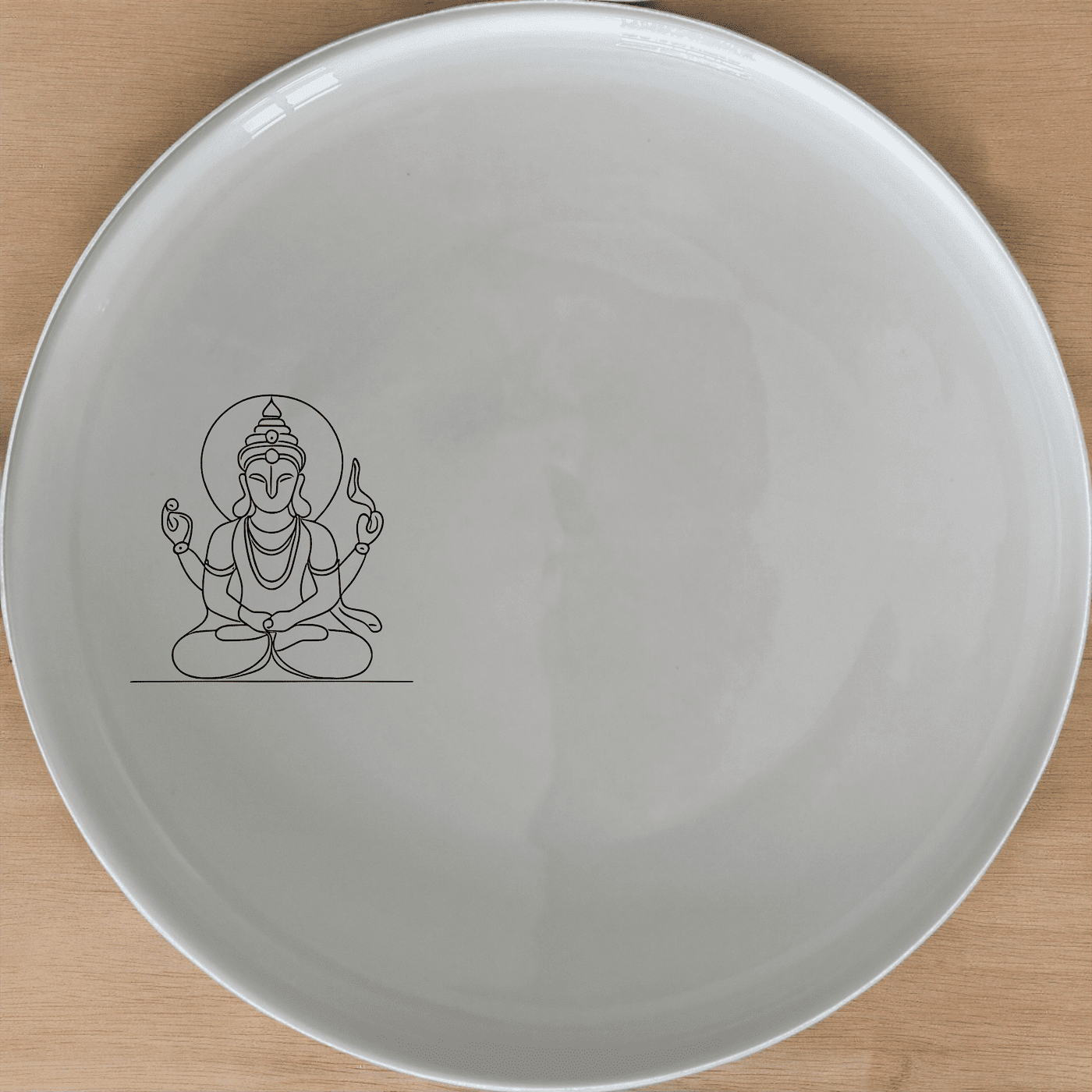 The Hindu Imagery Dinner Plate Set of 4 features a serene and spiritual design, perfect for adding a touch of culture to your dining experience.
