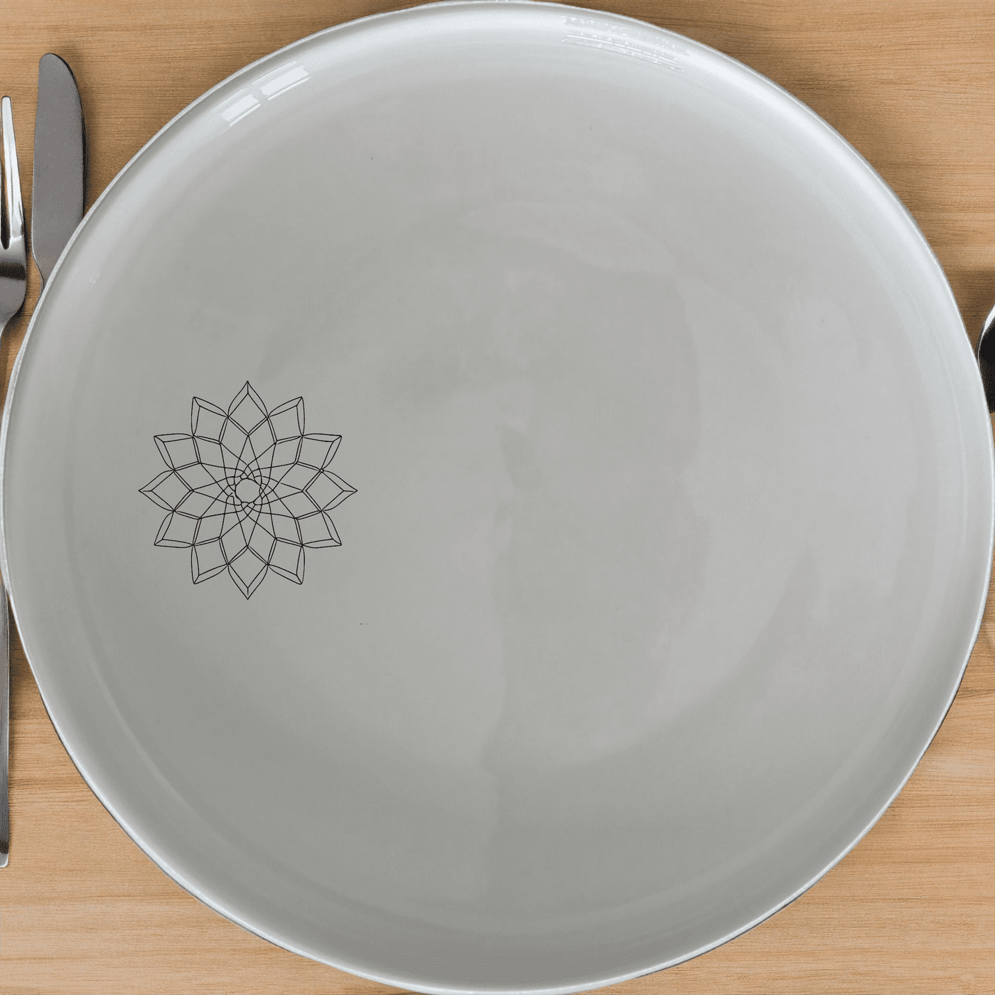 The Islamic Imagery Dinner Plate Set of 4 features elegant geometric designs, perfect for adding a touch of sophistication to any dining table.