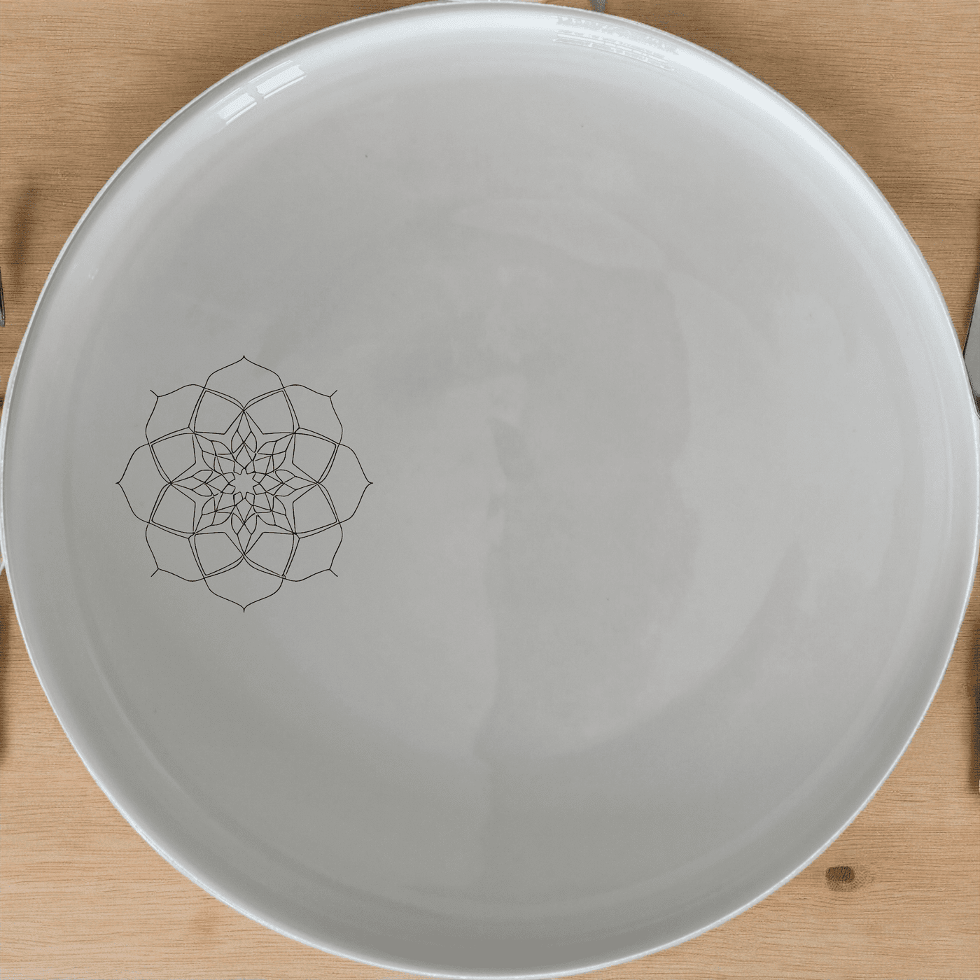 The Islamic Imagery Dinner Plate Set of 4 features elegant laser-etched designs on white ceramic plates, perfect for any dining occasion.
