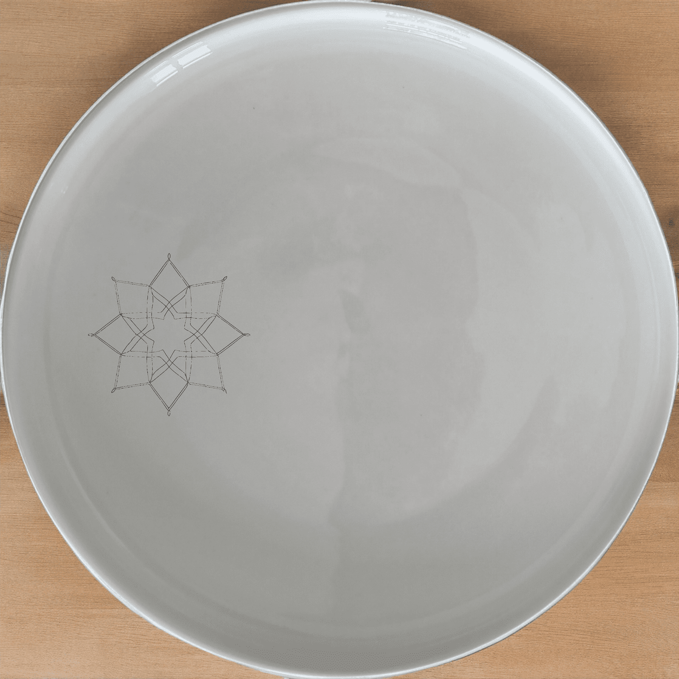 The Islamic Imagery Side Plate Set of 4 features elegant geometric patterns, perfect for adding a touch of cultural sophistication to any dining setting.