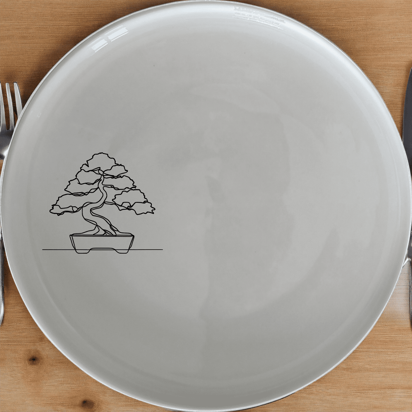 The Japanese Bonsai Tree Side Plate Set of 4 - Range 1 adds a touch of serene elegance to your dining table. Crafted from premium ceramic, these plates feature a minimalist design with a subtle bonsai tree etching, perfect for everyday use or special occasions.