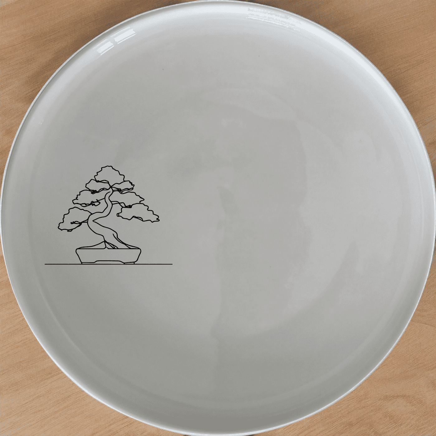 Japanese Bonsai Tree Side Plate Set of 4 - Range 1 is a beautiful set of four 21cm white ceramic side plates featuring a laser-etched bonsai tree design. Perfect for adding a touch of nature to your dining table.