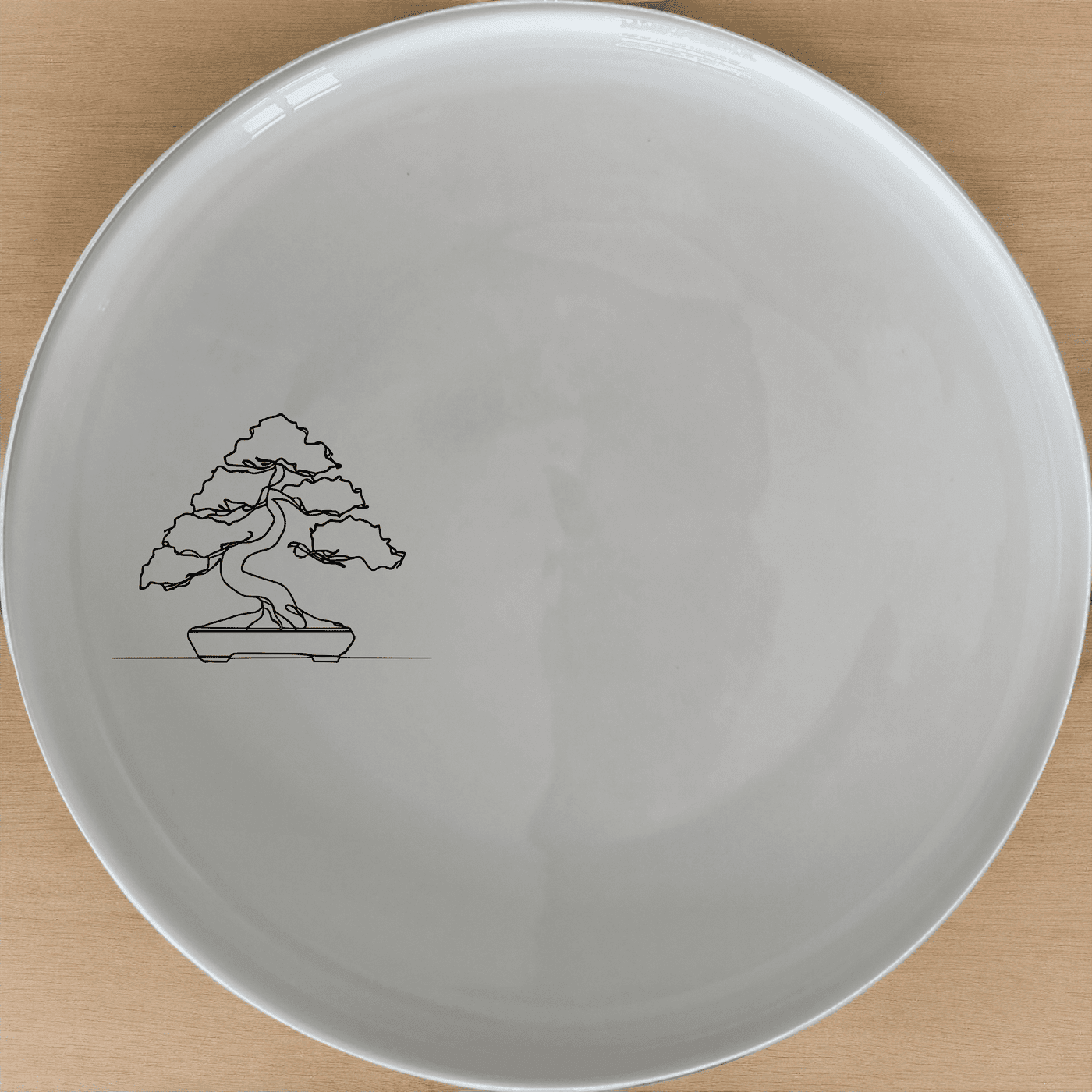 Japanese Bonsai Tree Side Plate Set of 4 - Range 4 is a beautiful and elegant set of four white ceramic side plates featuring a laser-etched bonsai tree design. Perfect for any dining occasion.
