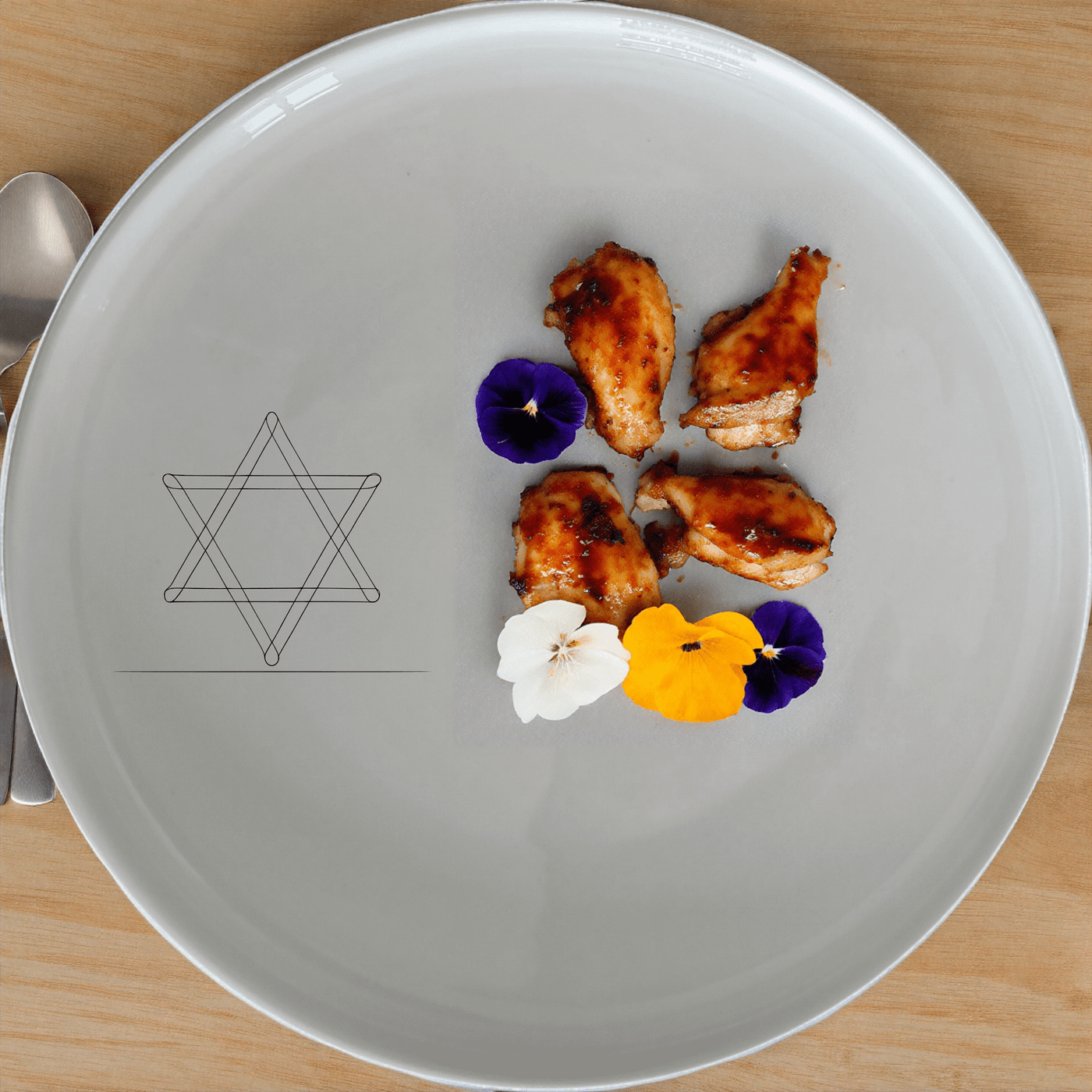 The Jewish Imagery Dinner Plate Set of 4 features a subtle yet meaningful design, perfect for everyday use or special occasions.