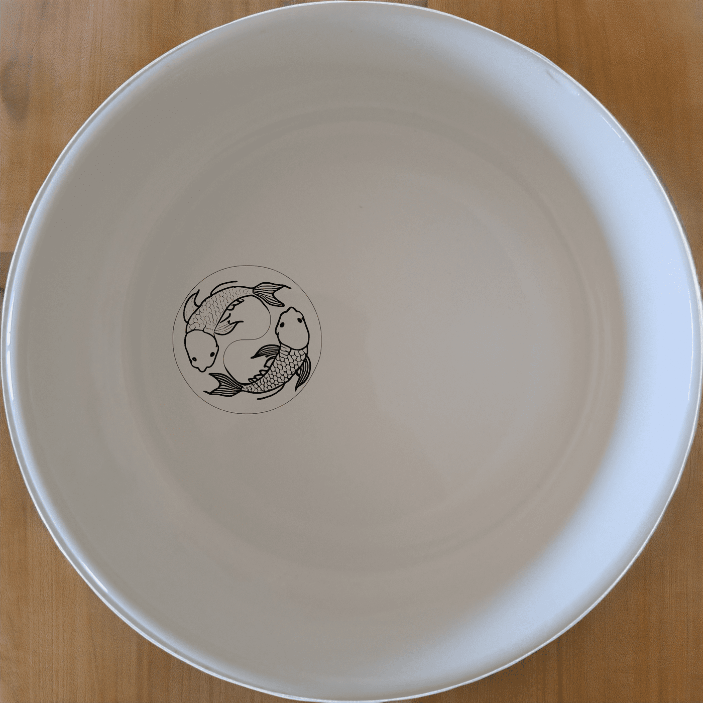The Yingyang Koi Fish Bowl Set of 4 brings a touch of serene elegance to your dining table with its harmonious design and timeless appeal.