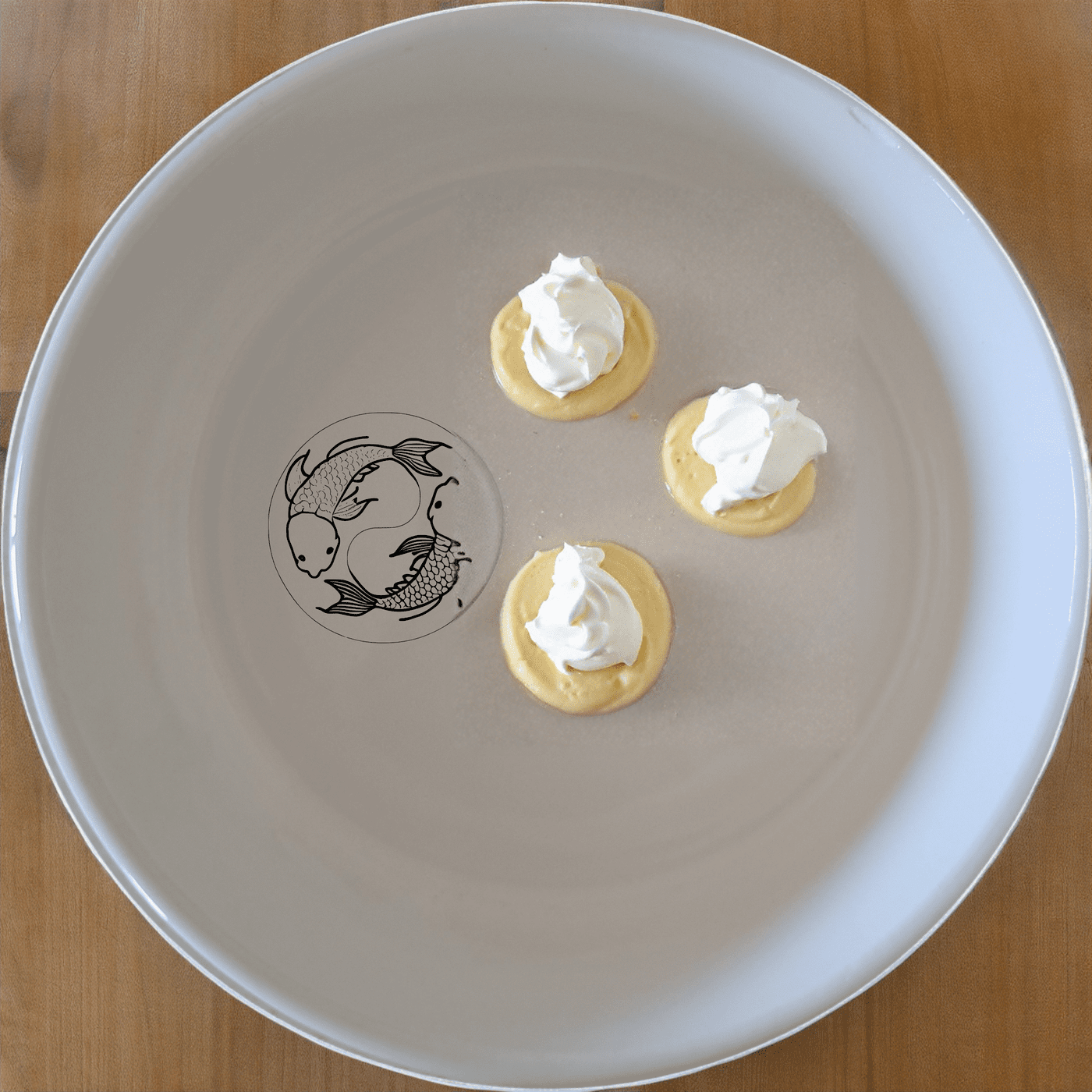 The Yingyang Koi Fish Bowl Set of 4 brings a touch of serene elegance to your dining table with its harmonious design and timeless appeal.