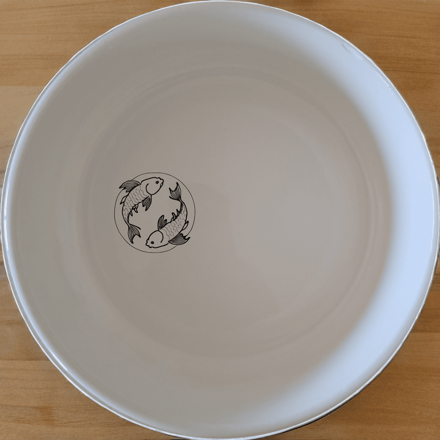 The Yingyang Koi Fish Bowl Set of 4 features a harmonious design inspired by the yin-yang symbol, perfect for adding an artistic touch to your dining experience.