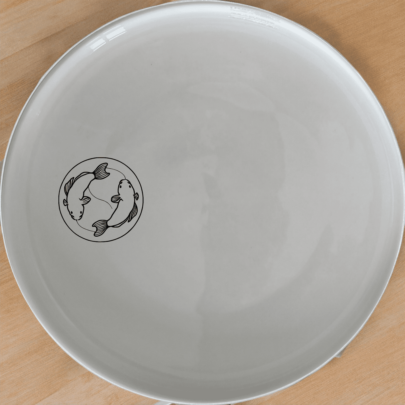 The Yingyang Koi Fish Dinner Plate Set of 4 features a harmonious design perfect for any dining occasion.