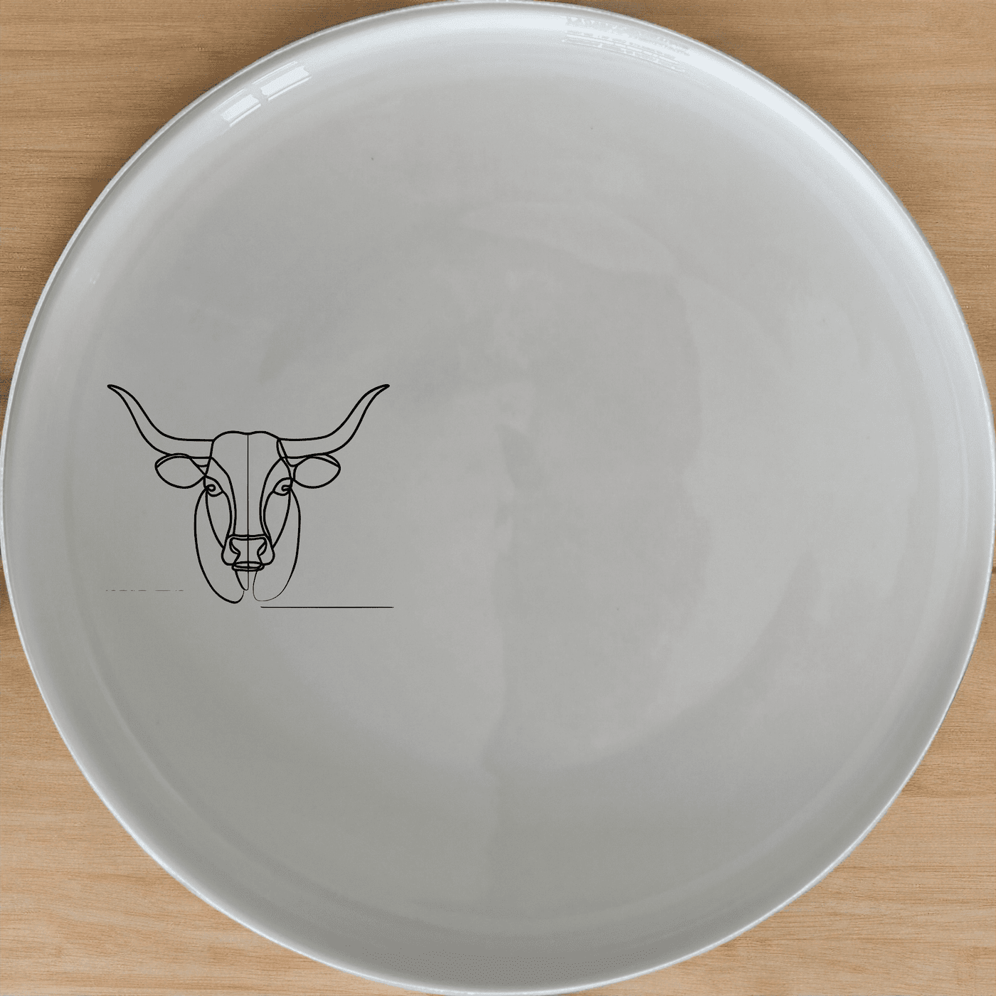The Long Horn Steer Dinner Plate Set of 4 - Range 4 features a sleek, minimalist design perfect for modern dining. Crafted from durable ceramic, these plates are microwave and dishwasher safe, making them ideal for everyday use or special occasions.