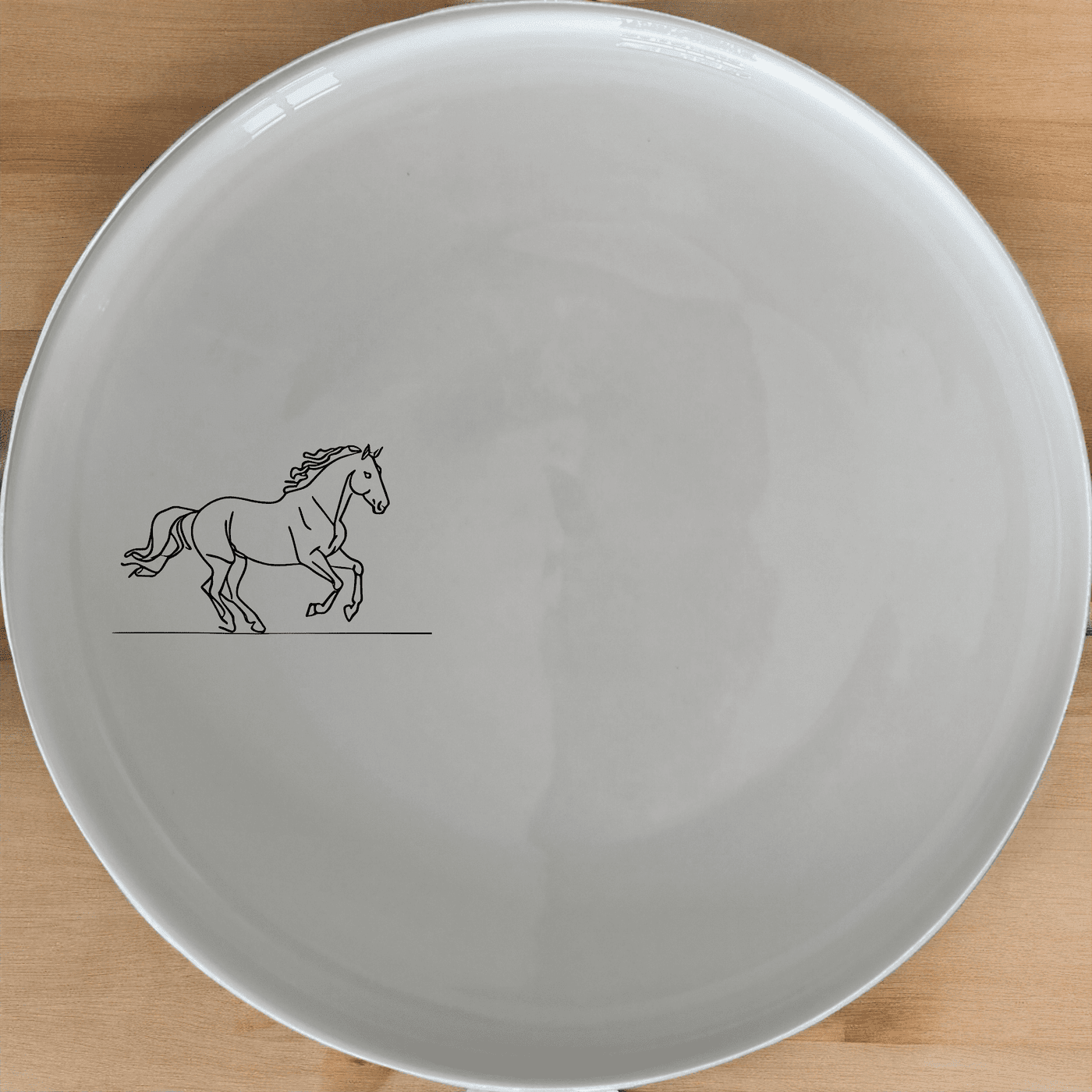 The Running Horses Dinner Plate Set of 4 features a sleek silhouette design, perfect for modern dining and everyday use.