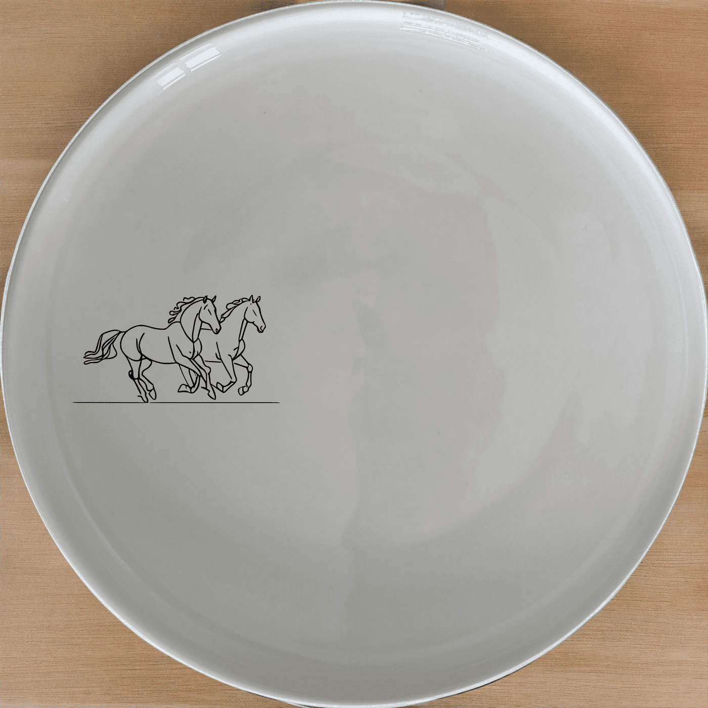 The Silhouette Running Horses Dinner Plate Set of 4 adds an artistic touch to your dining table with its sleek, minimalist design.