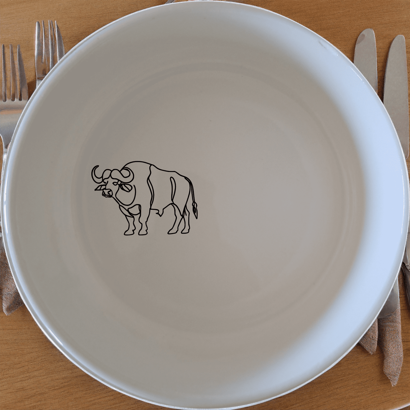 The African Buffalo Silhouette Bowl Set of 4 features a striking silhouette design, perfect for adding a touch of nature to your dining experience.