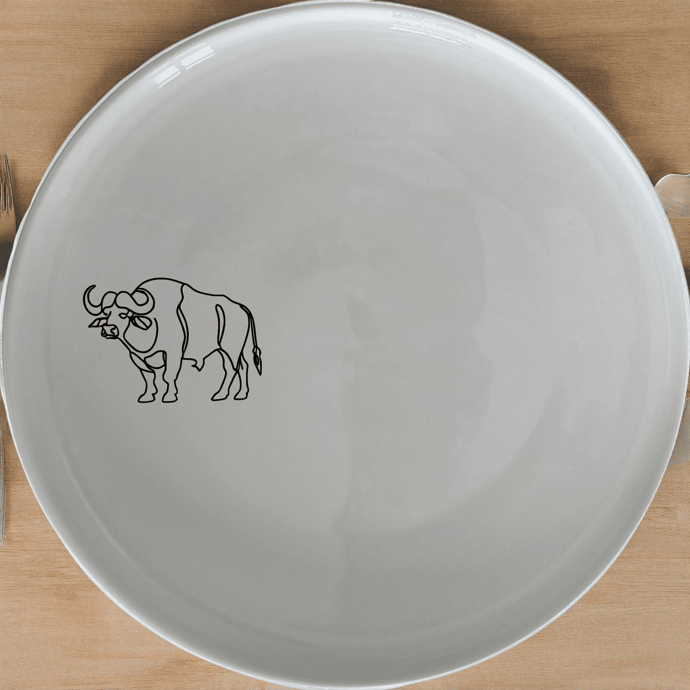 The Silhouette African Buffalo Dinner Plate Set of 4 adds a touch of wildlife elegance to your dining table with its sleek, minimalist design.