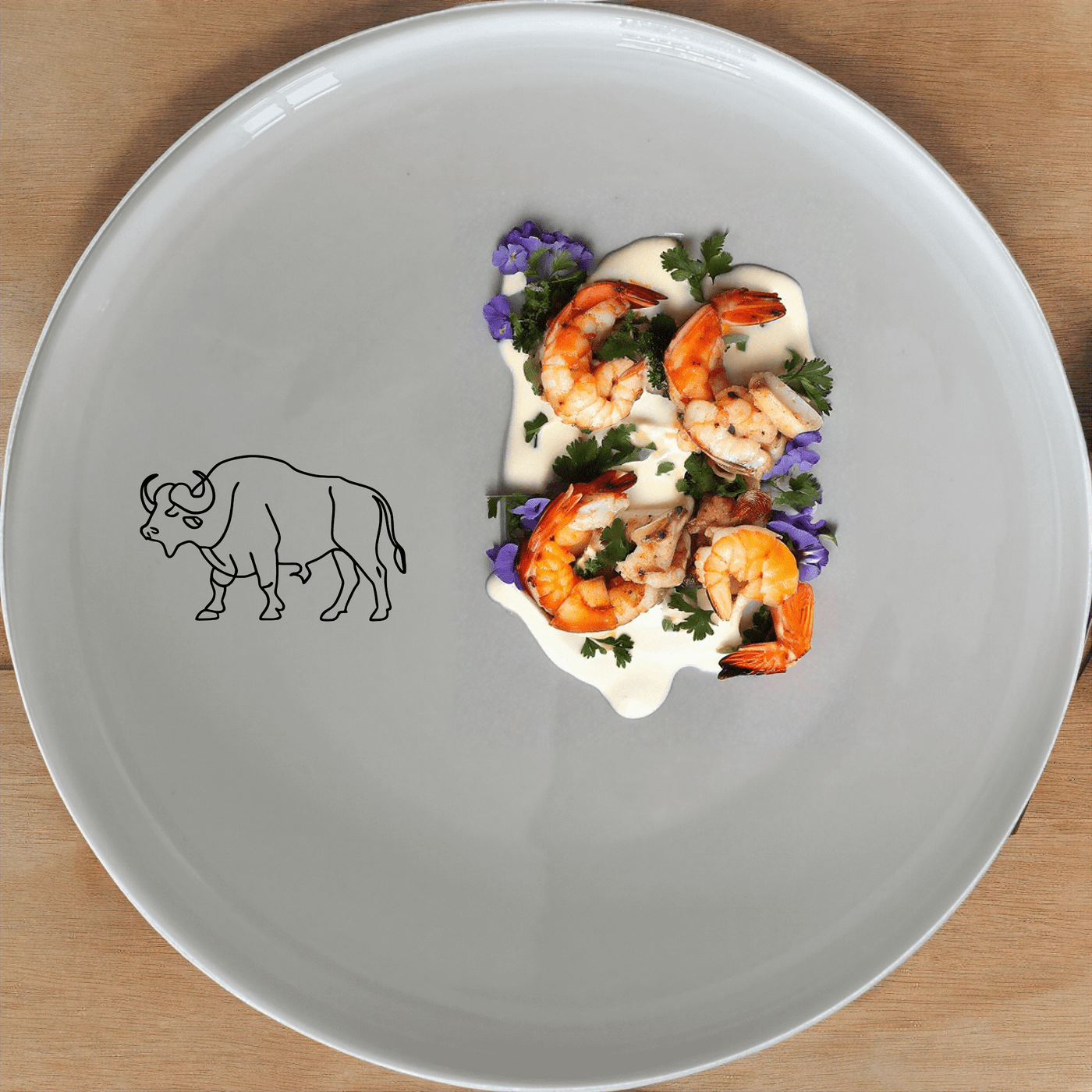 The African Buffalo Dinner Plate Set of 4 features a sleek silhouette design, perfect for modern dining settings.