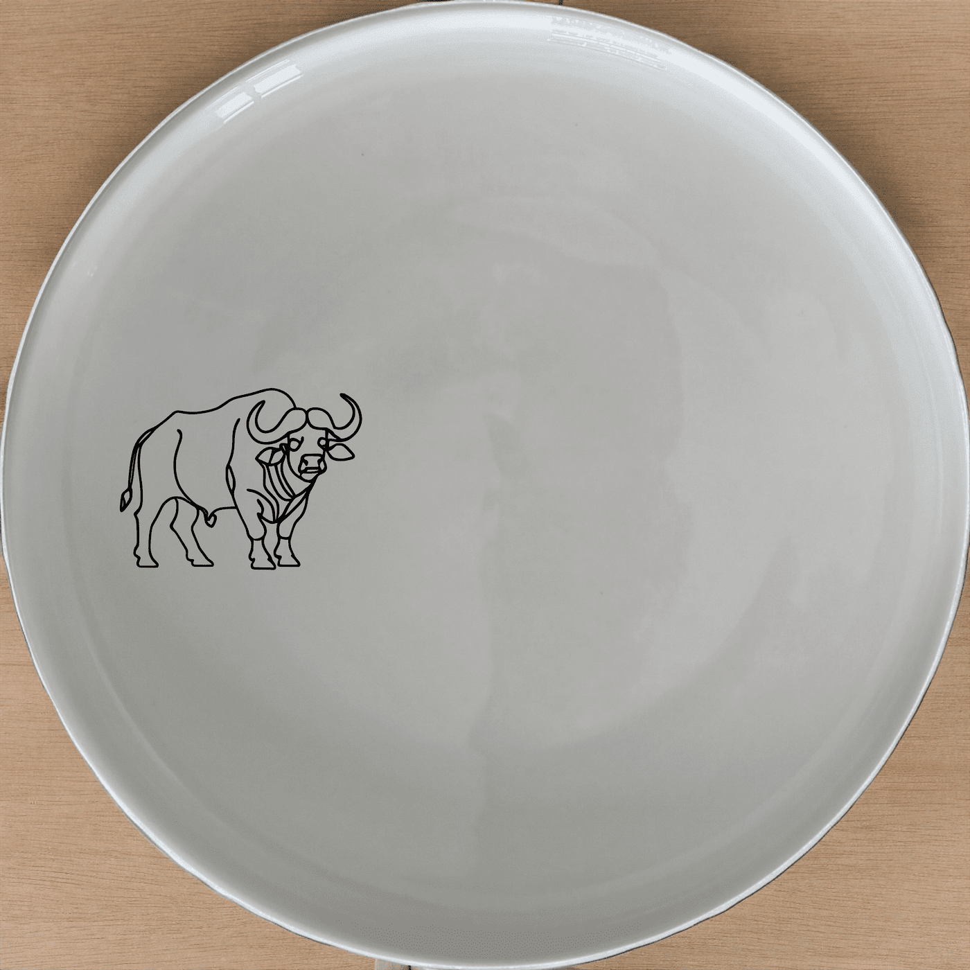 The Buffalo Silhouette Side Plate Set of 4 features a striking silhouette design, perfect for modern and rustic dining settings.