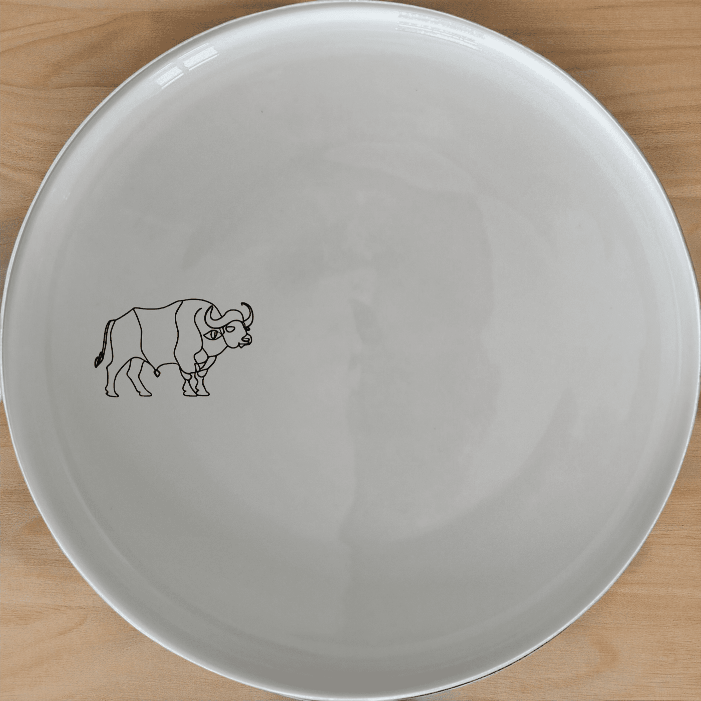 The Silhouette African Buffalo Side Plate Set of 4 is a stylish and modern addition to any dining table, featuring a sleek and minimalist design.