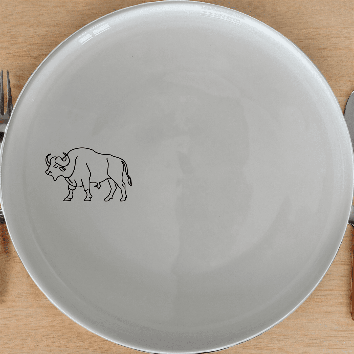 The African Buffalo Side Plate Set of 4 features a sleek silhouette design, perfect for modern dining and everyday use.