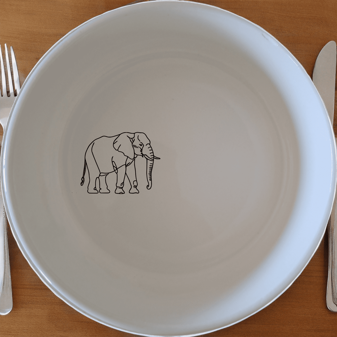 The Silhouette Big Five African Elephant Bowl Set of 4 features elegant elephant designs on white ceramic bowls, perfect for any dining occasion.
