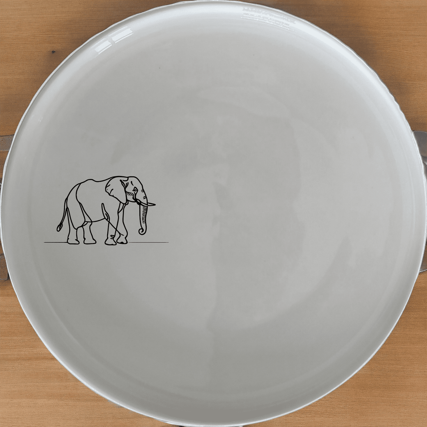 The Silhouette Big Five African Elephant Dinner Plate Set of 4 features a minimalist design perfect for modern dining.