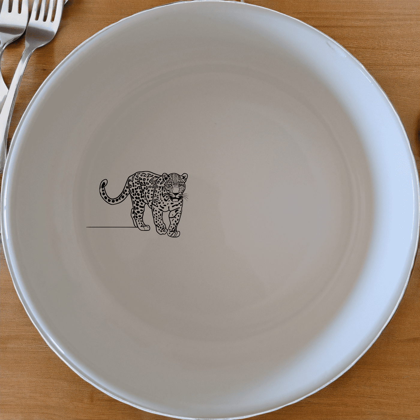 The Silhouette Big Five African Leopard Bowl Set of 4 features a striking silhouette of the African Leopard, perfect for adding a touch of wild elegance to your dining experience.