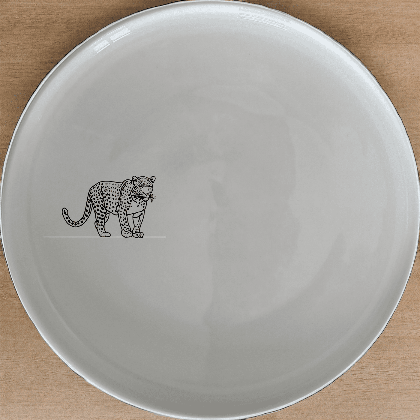 The Big Five African Leopard Dinner Plate Set of 4 features elegant silhouettes of the African leopard, perfect for a stylish dinnerware collection.