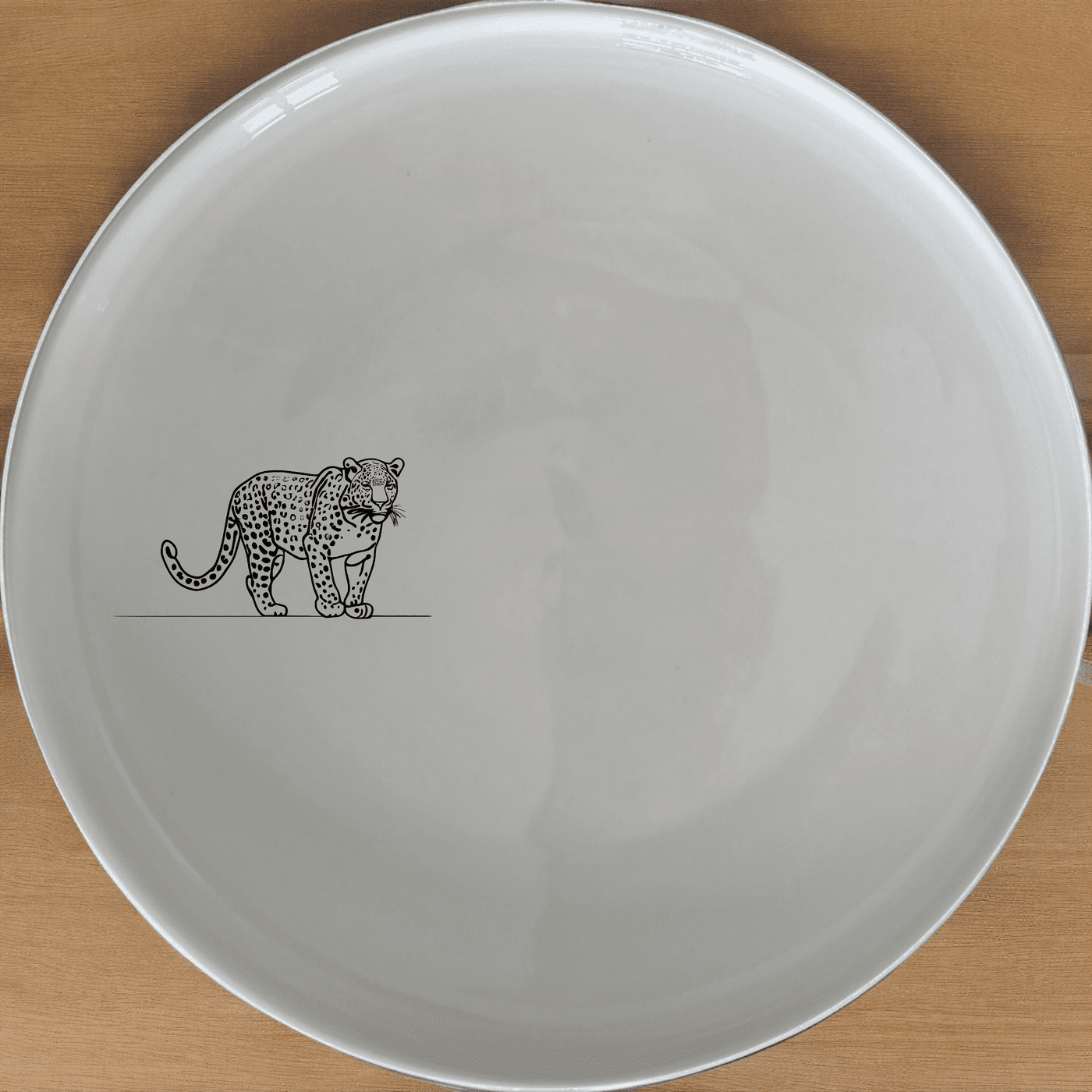 The Big Five African Leopard Side Plate Set of 4 features a sleek silhouette design, perfect for modern dining and adding a touch of wildlife elegance to your table.