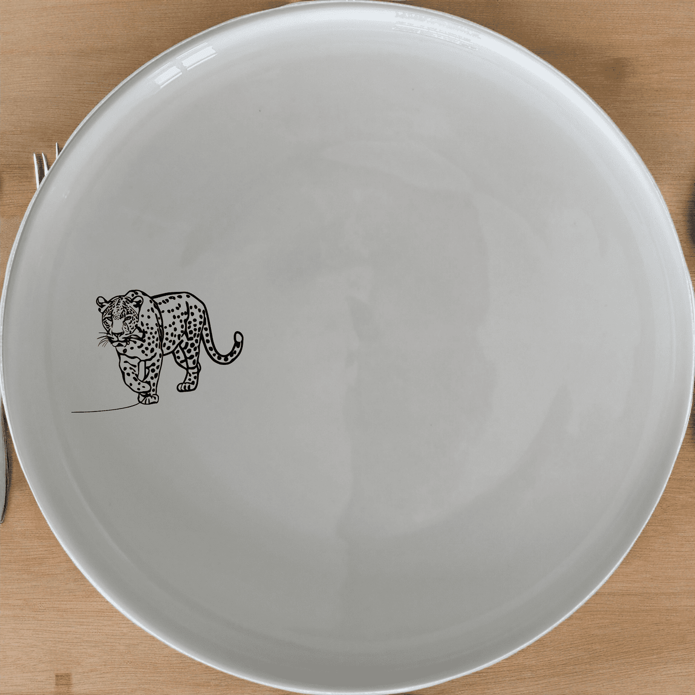 The Silhouette Big Five African Leopard Side Plate Set of 4 adds a touch of wild elegance to your dining table.