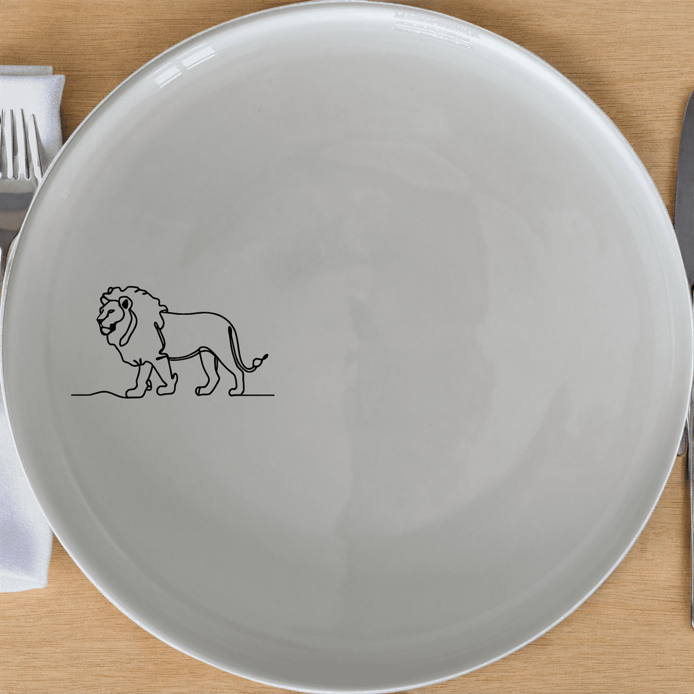 African Lion Side Plate Set of 4 offers a sleek, modern design perfect for any dining table. Crafted from durable ceramic, these plates feature a minimalist silhouette of the African lion, adding a touch of wildlife elegance to your meals.