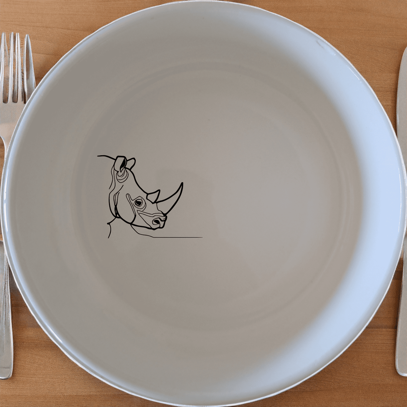 The Silhouette Big Five African Rhino Bowl Set of 4 features a minimalist design with an elegant silhouette of an African rhino, perfect for modern and stylish dining.