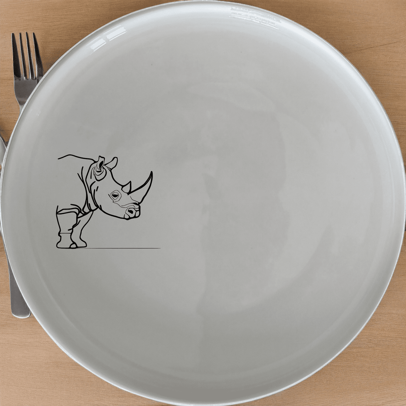 The Silhouette Big Five African Rhino Dinner Plate Set of 4 features a minimalist design perfect for modern dining. Each plate showcases a sleek African rhino silhouette, adding a touch of wildlife elegance to your table setting. Crafted from durable ceramic, these plates are microwave and dishwasher safe, making them ideal for everyday use or special occasions.