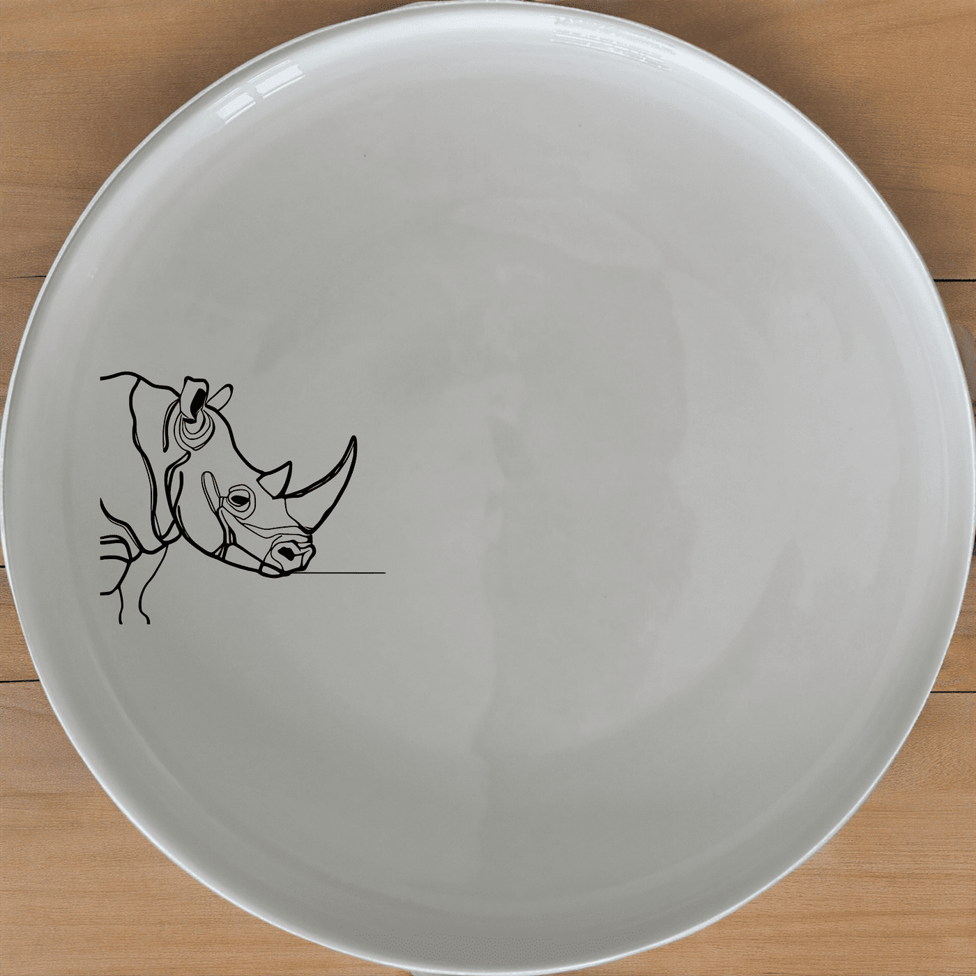 Discover the Silhouette Rhino Dinner Plate Set of 4, a striking addition to any dining collection. These plates feature a bold, minimalist design that brings a touch of modern art to your table.