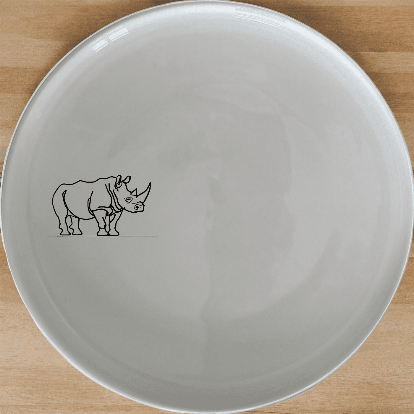 The Silhouette Rhino Side Plate Set of 4 features a striking rhino design, perfect for adding a touch of wildlife to your dining experience.