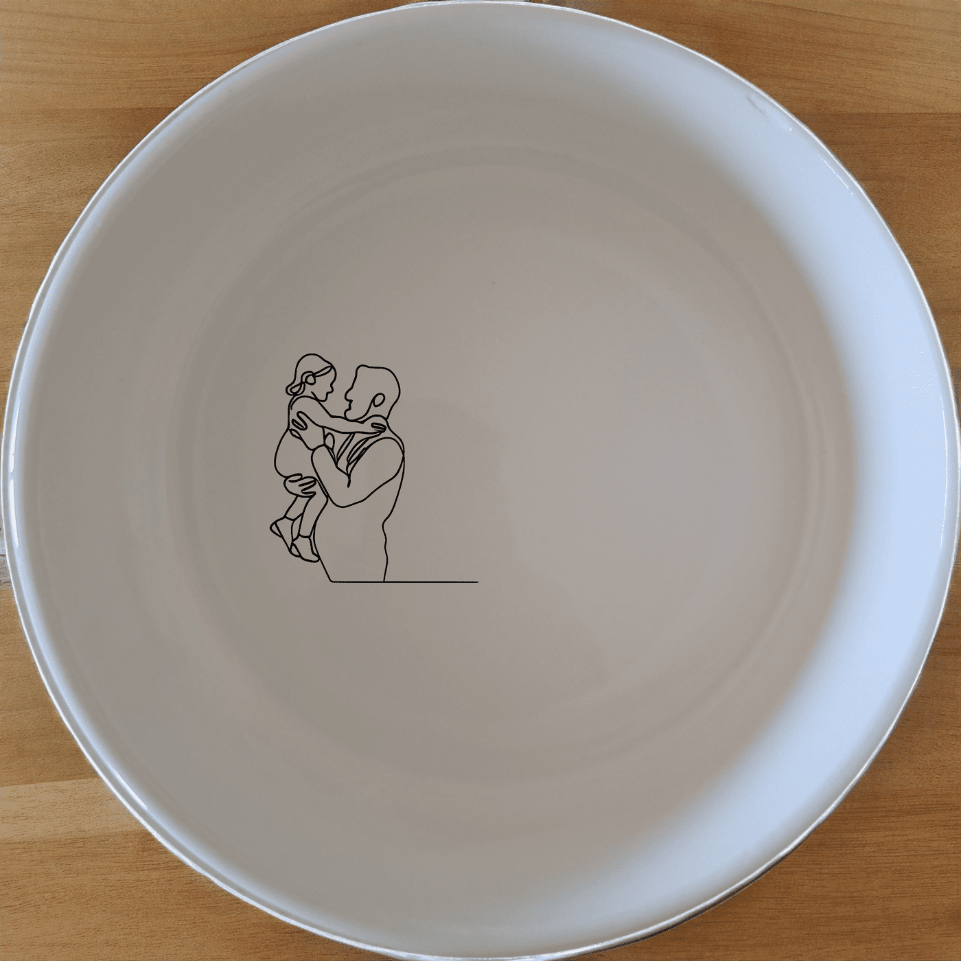 The Sillohette Father Daughter Bowl Set of 4 - Range 3 is a beautifully designed set of four white ceramic bowls, each featuring a unique laser-etched silhouette of a father and daughter. Perfect for everyday use or special occasions, these bowls add a touch of warmth and elegance to your dining table.