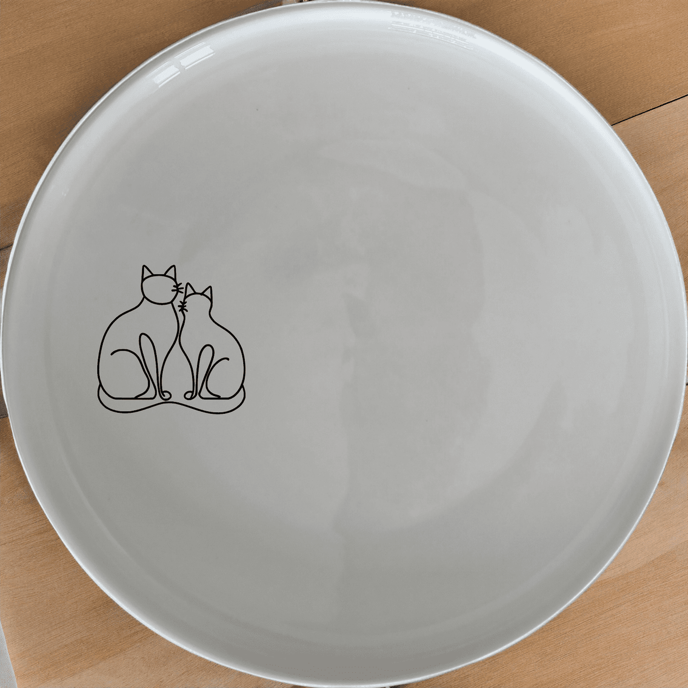 The Sillouhette Fat Curvey Cats Side Plate Set of 4 - Range 3 is a charming and stylish addition to any dining table, perfect for cat lovers.