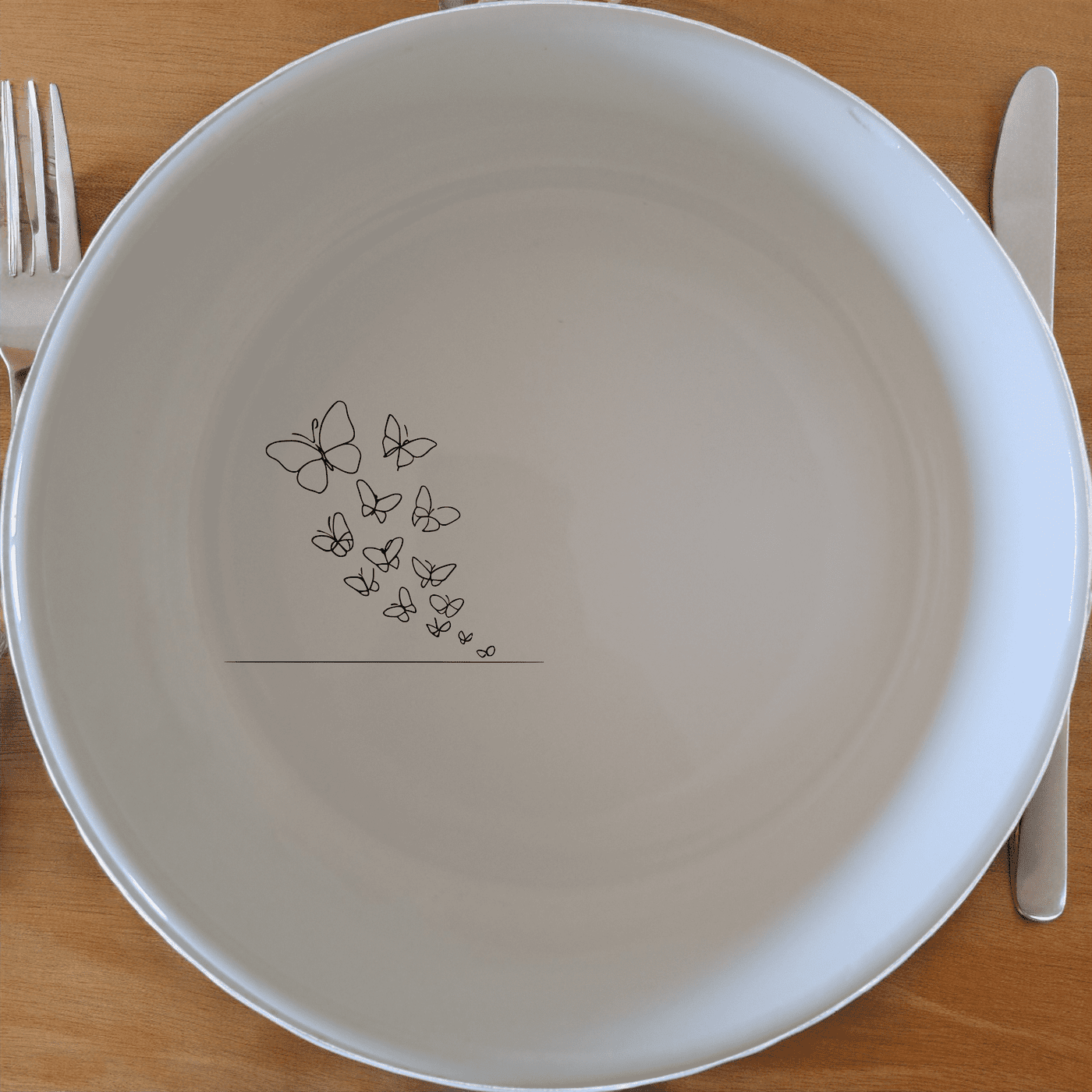 Swarm Delicate Butterflies Bowl Set of 4 - Range 1 is a beautifully designed set of four white ceramic bowls featuring a delicate butterfly pattern.