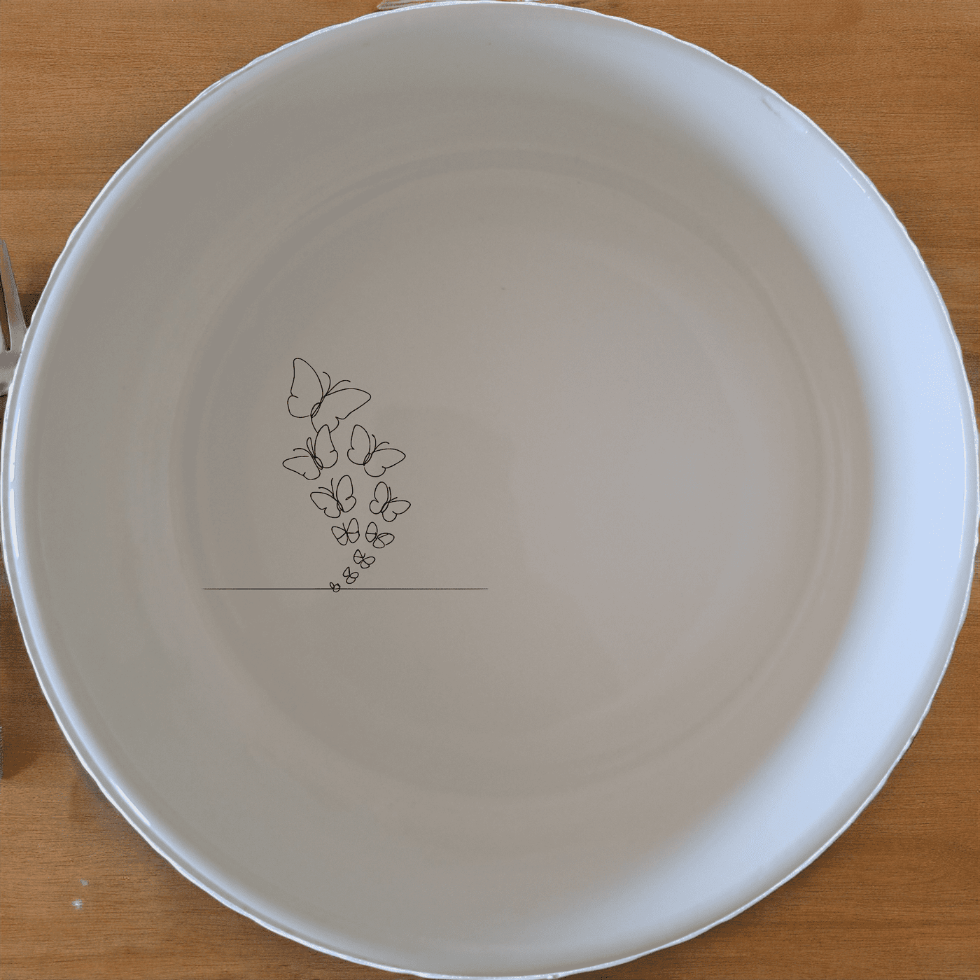 The Swarm Delicate Butterflies Bowl Set of 4 - Range 2 is a beautifully designed set of four ceramic bowls, each featuring an intricate laser-etched butterfly design. Perfect for everyday use or special occasions, these bowls add a touch of elegance to your dining experience.