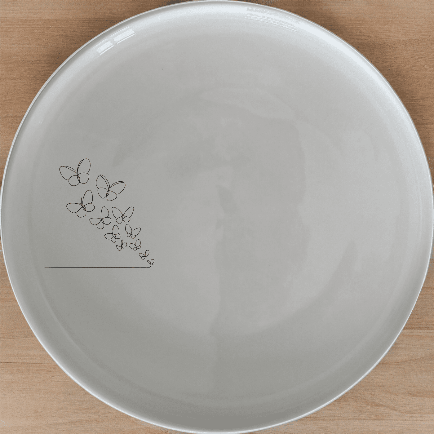 Delicate Butterflies Dinner Plate Set of 4 - Range 28 adds a touch of nature to your dining table with intricate butterfly designs.