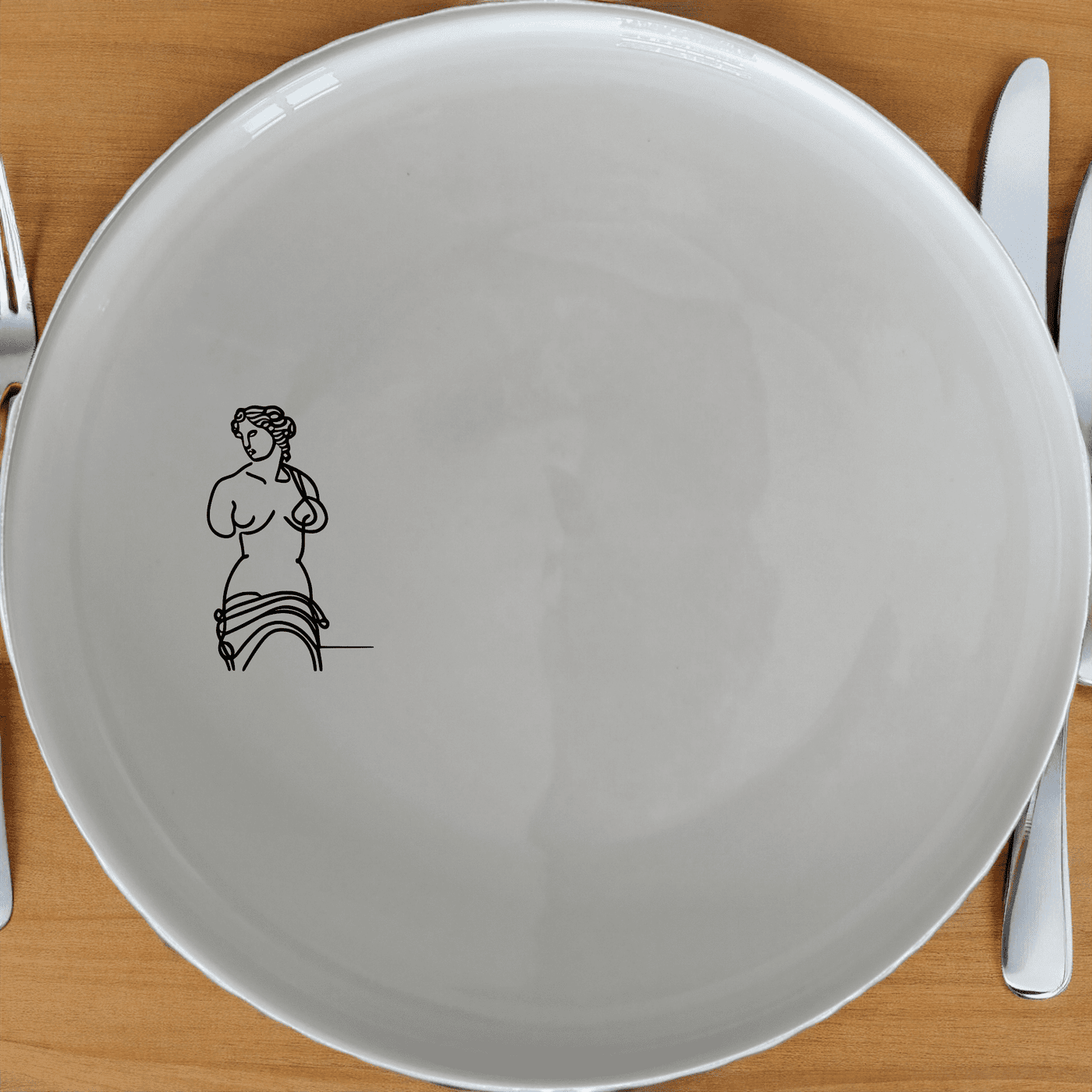 Venus Milo Side Plate Set of 4 - Range 1 is a stunning collection of four elegant side plates, each featuring a delicate laser-etched design of the iconic Venus de Milo statue. Crafted from premium ceramic, these plates are perfect for both everyday use and special occasions.
