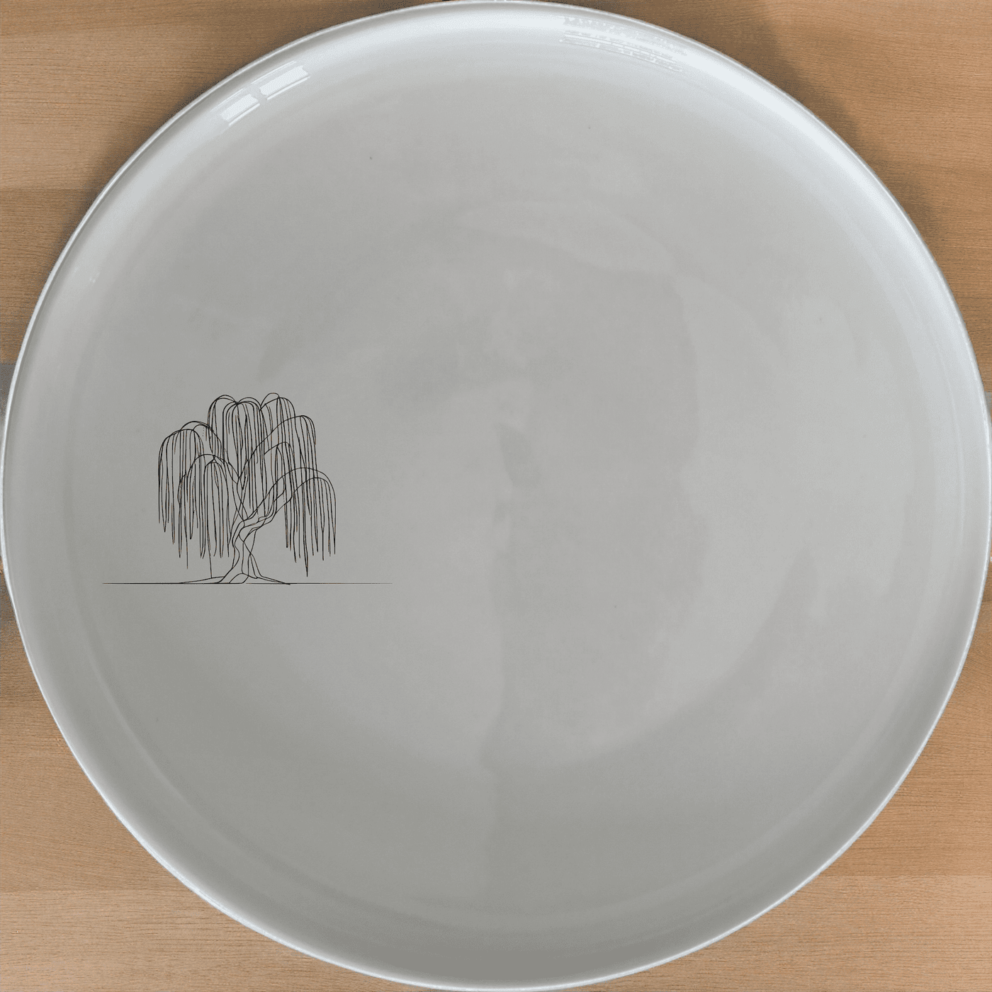 The Weeping Willow Tree Dinner Plate Set of 4 - Range 1 is a beautiful and elegant addition to any dining table. These plates feature a delicate laser-etched design of a weeping willow tree, adding a touch of nature to your meals.