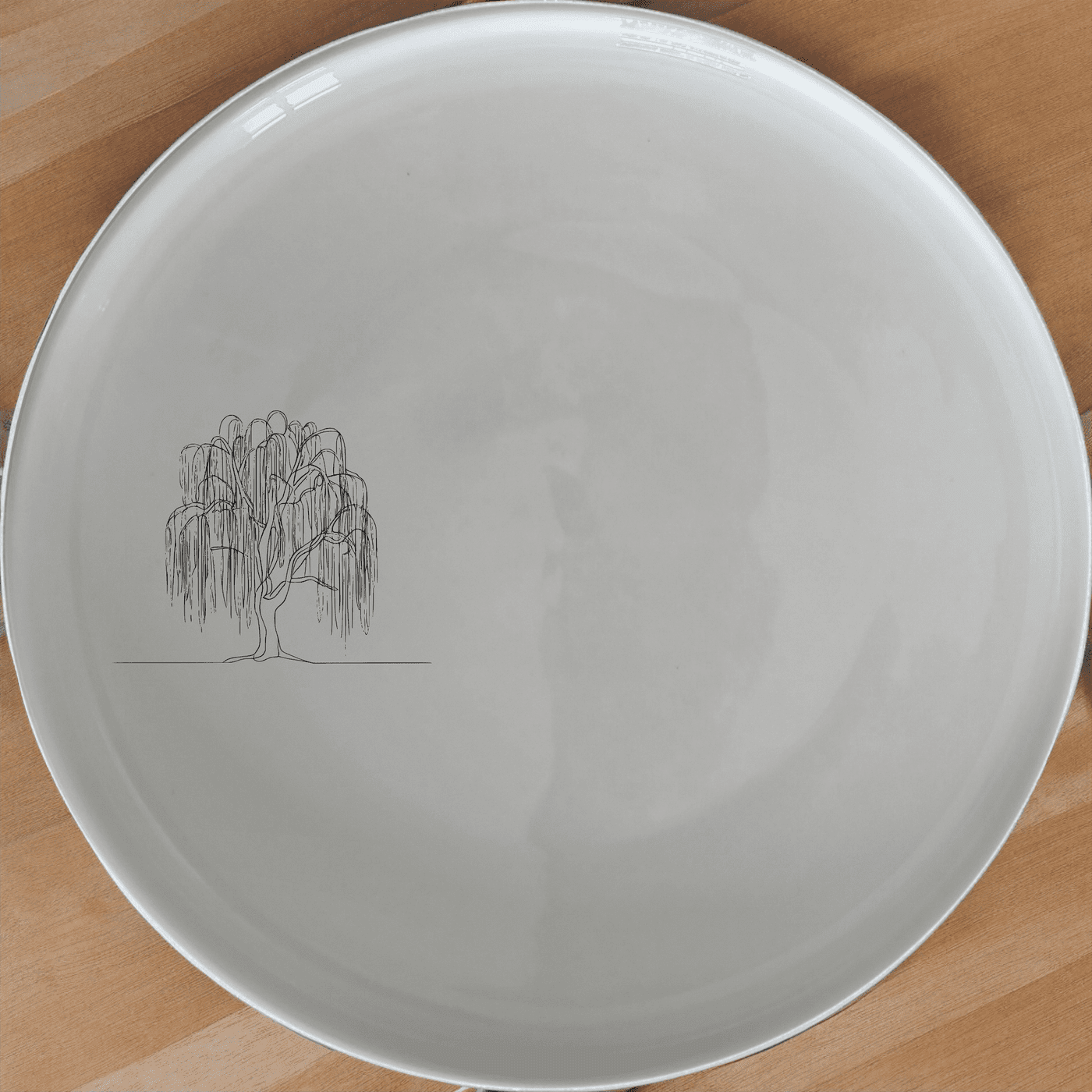 The Weeping Willow Tree Side Plate Set of 4 - Range 4 features a delicate laser-etched design on a smooth white ceramic surface, perfect for everyday use or special occasions.