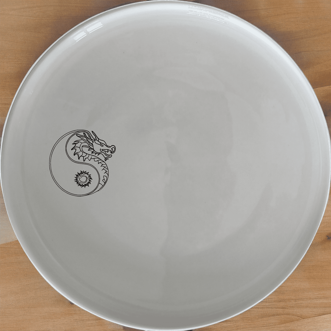 Yingyang Chinese Dragons Dinner Plate Set of 4 - Range 4 is a stunning set of four dinner plates featuring an intricate yin-yang design with dragons. These plates are perfect for adding a touch of elegance to any dining table.
